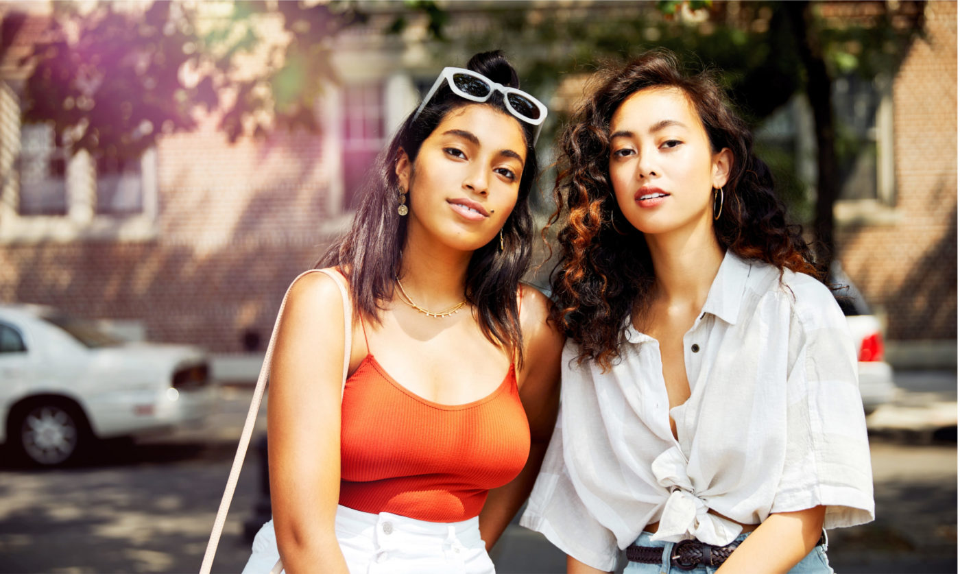 Two girlfriends are looking at the camera